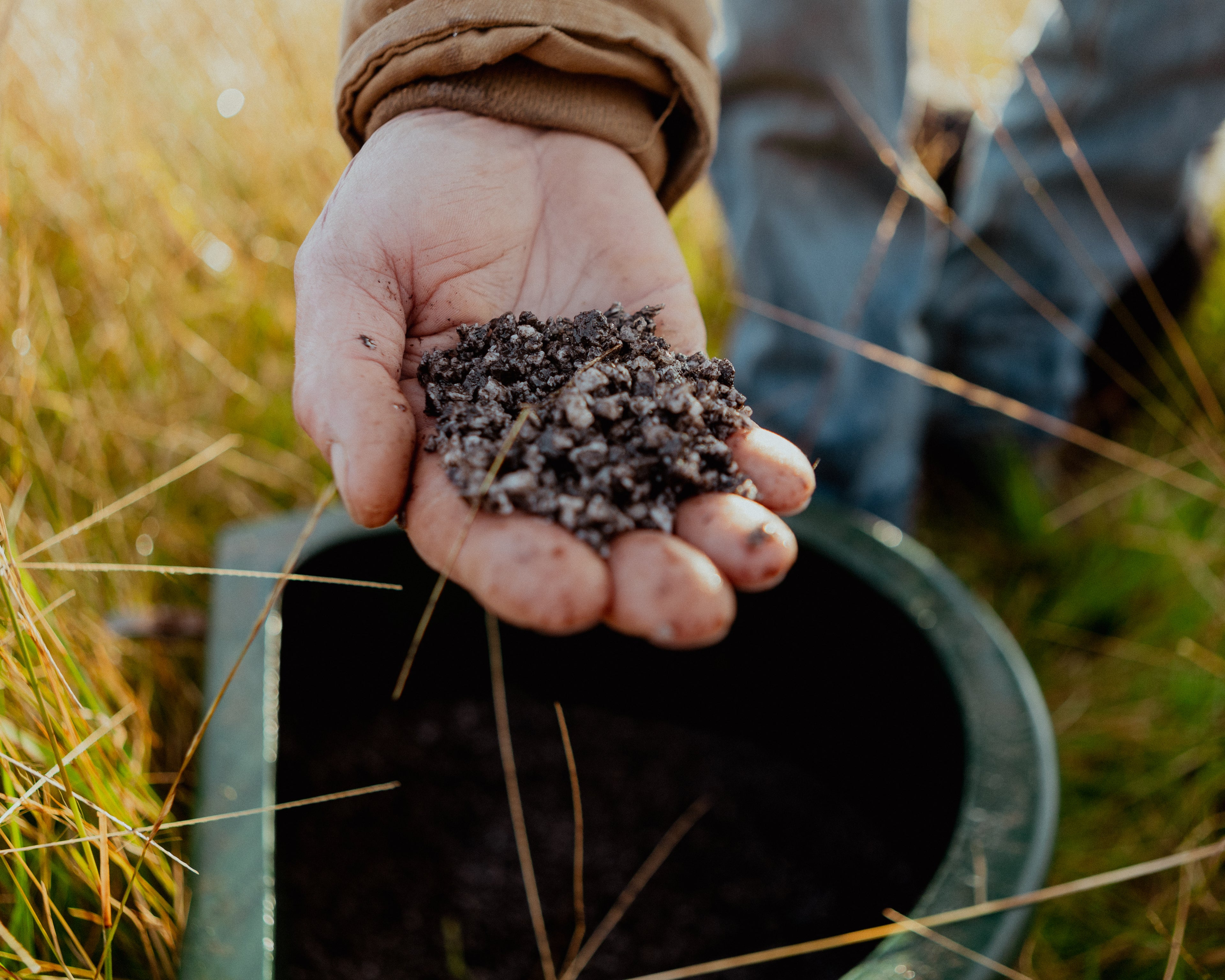 Hand holding Sea-90 premium mineral salt.